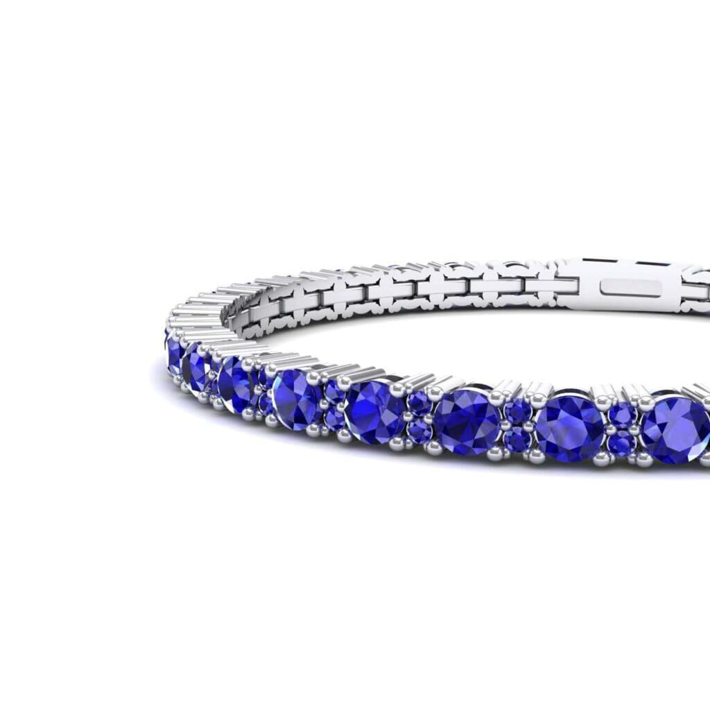 Thin Brilliant Round Blue Sapphire Tennis Bracelet (2.1 CTW) 3970 Render 1 01 Camera2 Stone 3 Blue Sapphire 0 Floor 0 Metal 4 White Gold 0 Emitter Aqua Light 0