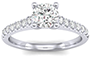 Accent stone with diamonds on the side providing the accent