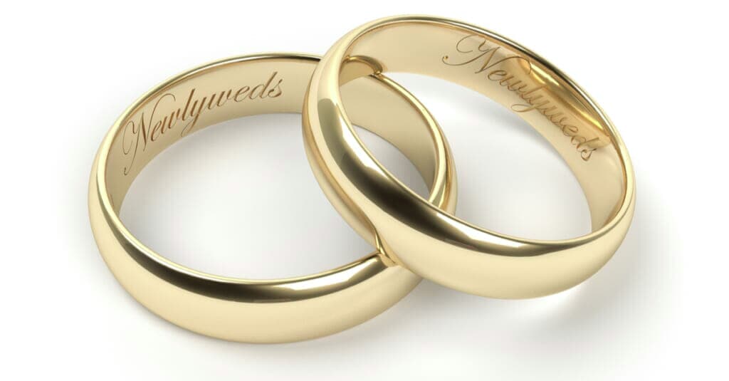 gold engraved rings with newlywed text