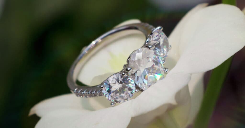 three-stone ring on flower