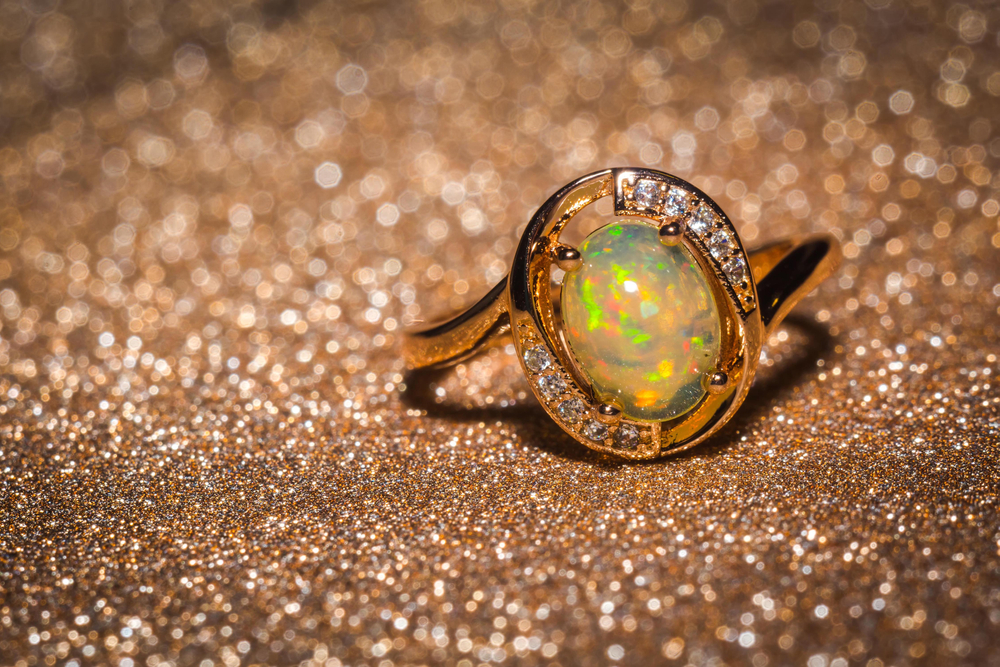Fashion,rose,gold,ring,with,a,bright,rainbow,flash,opal